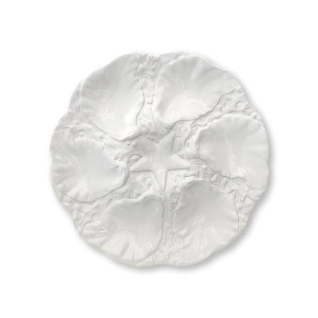 Mid-century entertaining never looked so chic. This set of six white majolica oyster plates by Bordallo Pinheiro (Caldas...