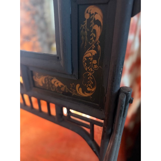 Very heavy and well made. A mirrored fire screen in the chinoiserie style. Painted dark brown