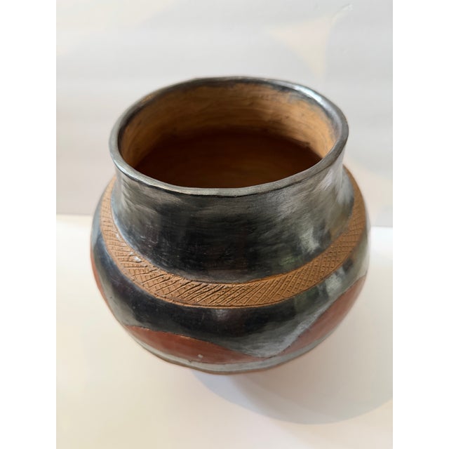 Beautiful handmade earthenware pottery vessel crafted and fired by the women of the Makarunga tribe in Zimbabwe. This...
