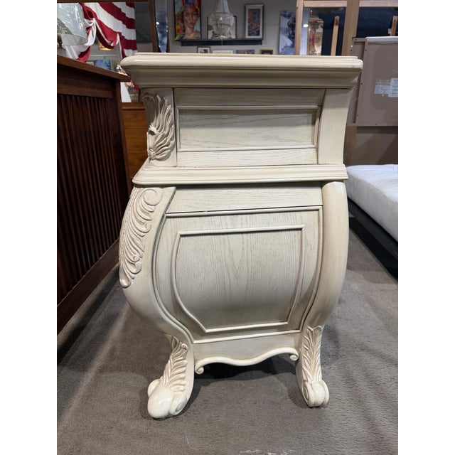 This Acme Furniture nightstand is a beautifully detailed piece that brings classic European-inspired elegance to the...