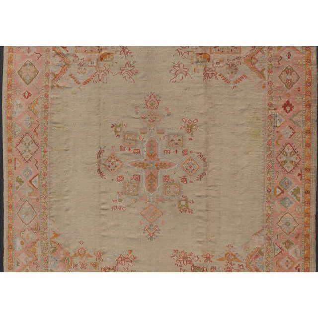 Antique Oushak Carpet With Medallion On A Pale Green Field with Vivid Border. Keivan Woven Arts; rug F-0305, Country of...