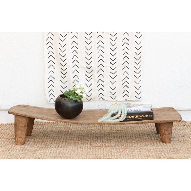 A unique addition to your home, this Senufo coffee table, crafted from a single log of wood, this antique Senufo table is...