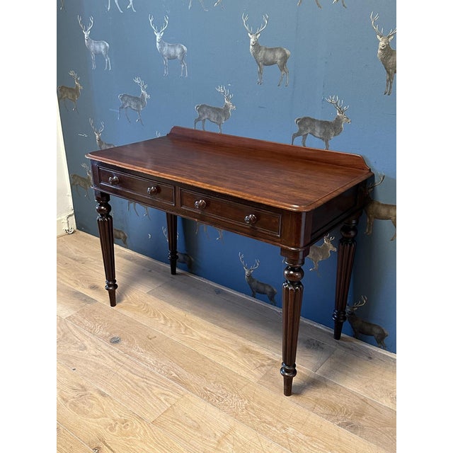 Antique Victorian console table / writing desk with 2 drawers. In good condition throughout. The table is entirely made of...