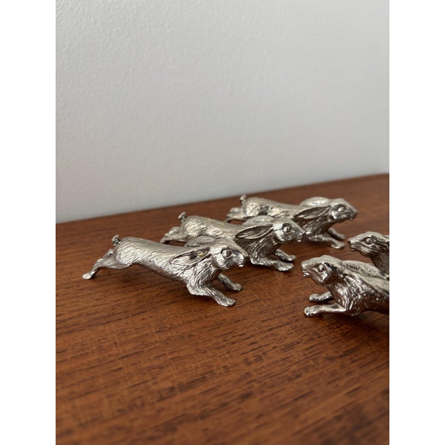 Adorable set of 6 antique silver-plated metal knife rests depicting rabbits in full flight. These charming pieces add an...