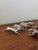 Adorable set of 6 antique silver-plated metal knife rests depicting rabbits in full flight. These charming pieces add an...