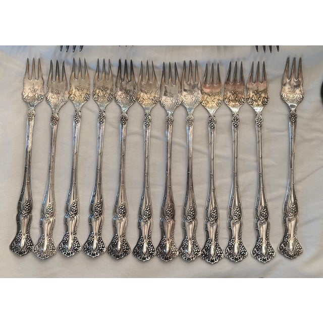 A remarkably complete 1847 Rogers Bros. “Vintage” silverplate flatware master set in the iconic grape and vine pattern...