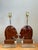 This distinguished pair of vintage carved wood horse head table lamps beautifully combines organic craftsmanship with the...