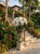 Vintage Classical Cast Stone Garden Urn With Fleur-De-Lis Relief & Weathered Patina For Sale - Image 12 of 12