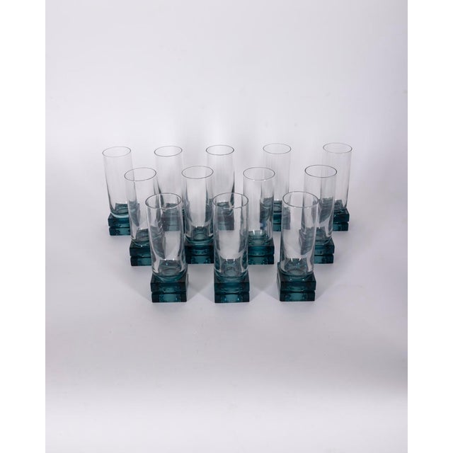 Set of 12 glasses with a square base in blue crystal and a transparent goblet, Italian design, 1970s.