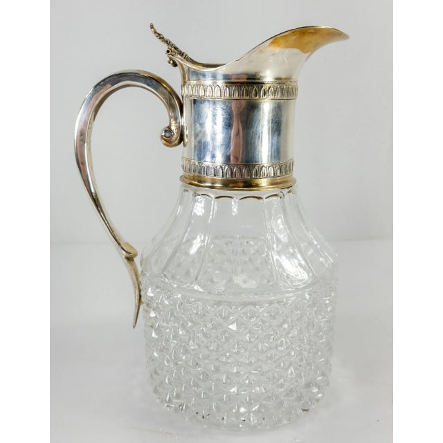 We are selling this nice elegant Silver plated water pitcher or decanter. This claret jug like silver plate pitcher has...
