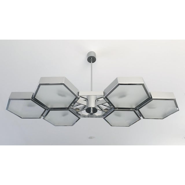 Impressive Italian chandelier with 6 hexagonal glossy glass diffusers in satin finish on the back, mounted on thick...