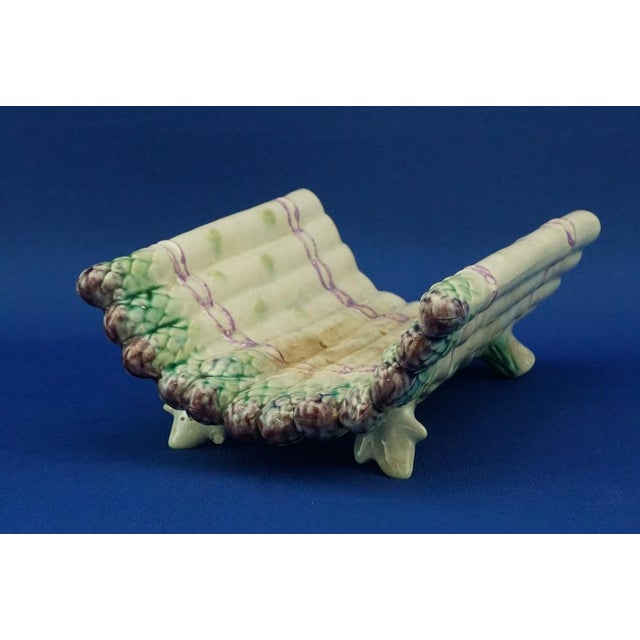 Item description: Fabulous asparagus holder, made of heavy ceramic, modeled and decorated entirely by hand, then glazed...