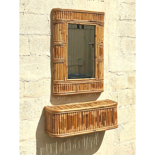 Elevate your space with this stunning vintage coastal console mirror and table set, expertly crafted with intricate woven...