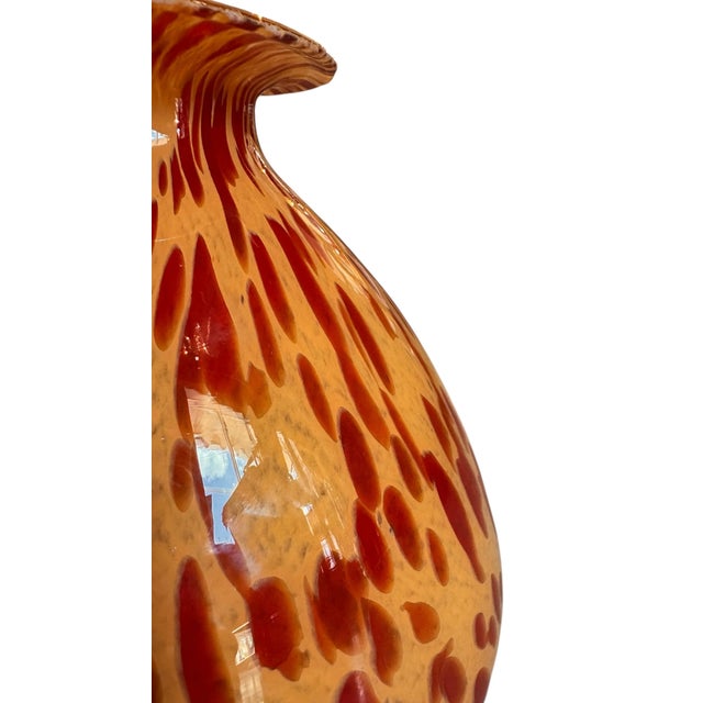 10 3/4”Diameter x 8”H This Italian hand-blown art glass vase is a sophisticated example of organic texture and warmth,...