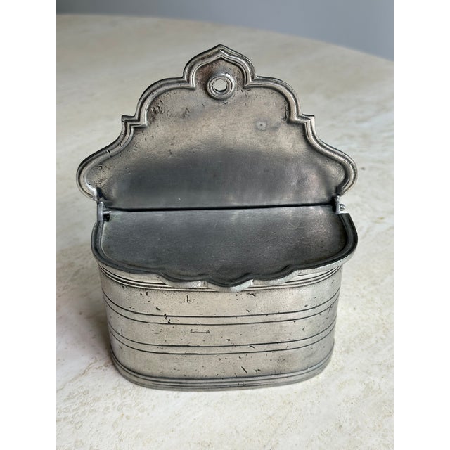 A beautiful antique French pewter wall salt box stamped "Etain 95%" — indicating high-quality 95% tin content pewter, the...
