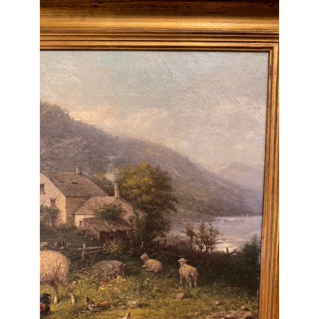 The is an 19th Century American Oil of a mountainous landscape with sheep at the farm. It is signed by the American...