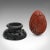 This is a small vintage decorative egg. A Chinese, cinnabar ornament on ebonised display stand, dating to the mid 20th...