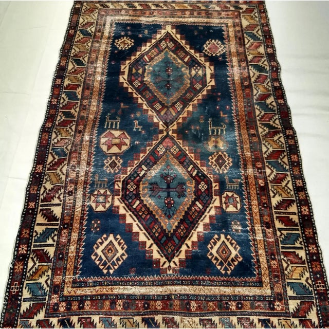 A superb example of 19th-century Caucasian weaving, this Caucasian Kazak area rug from the late 1800s beautifully...