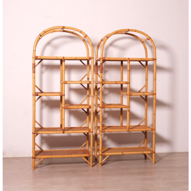 Beautiful 1970s bamboo bookcases, arched in shape. The wavy shelves add originality to this beautiful, timeless piece.