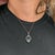 A 2.99-carat aquamarine glows in a soft sky-blue at the centre of this solid two-tone 14K white and rose gold pendant,...