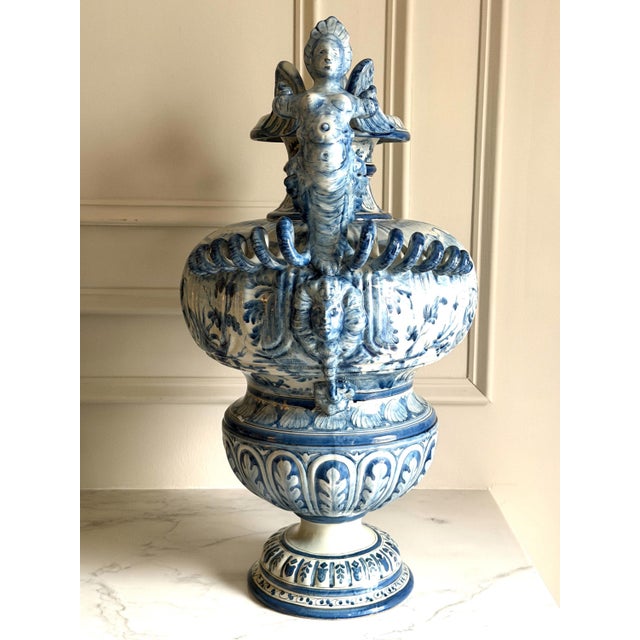 A magnificent piece with hand painted scenes and patterns. Tiny glaze chips as shown in the last few pictures, otherwise...