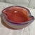 Offered here is a murano dish with a fuchsia core inside an opalescent milky-white or lavender-tinted outer glass casing....