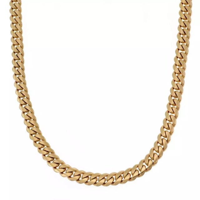 This long men's curb link chain is crafted from 14k & 13k mixed links in yellow gold with a polished finish. The links are...