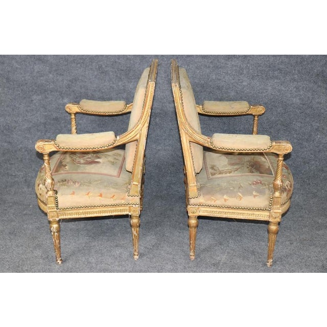 This exquisite pair of late 19th-century French Louis XVI-style armchairs represents the elegance, refinement, and...
