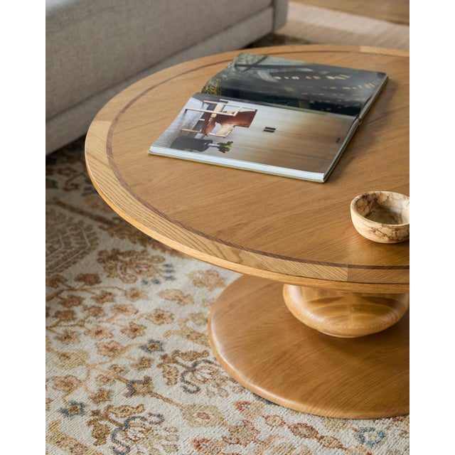 Introduce a classic yet modern appeal to your living space with the Adour Coffee Table. This updated traditional piece is...