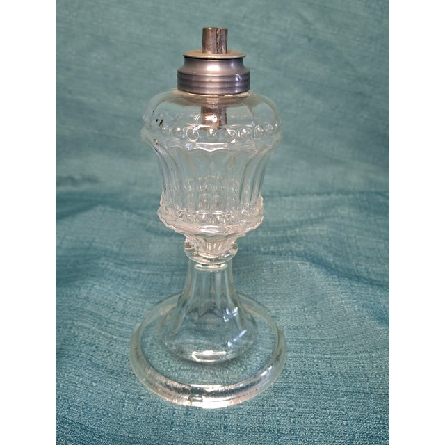 Offered for sale is a stunning matching pair of antique whale oil pedestal lamps from the early Victorian era, circa...
