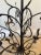 Gorgeous 8 light chandelier by Ironware International, featuring organically shaped branches and leaves that become a...