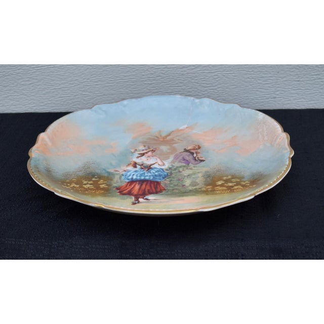Antique : 1920's Round Decorative Hand Painted Courting Scene Plate. The Brand is LRL Limoges. The Origin is France. The...