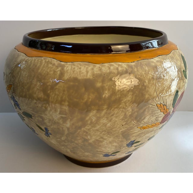 An exceptional hand-painted ceramic centerpiece bowl by the celebrated French pottery atelier Jérôme Massier of Vallauris,...