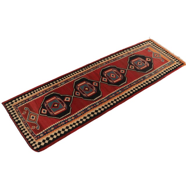 Handwoven in wool, a vintage Kurdish Kilim unveiled from R&K Principal Josh Nazmiyal’s coveted treasury of Persian...