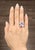 This exquisite cocktail ring is a stunning display of luxury and craftsmanship, designed to captivate with its brilliance...