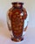 Richly decorated vintage Japanese porcelain vase by Gold Imari, featuring alternating figural and floral panels in a...