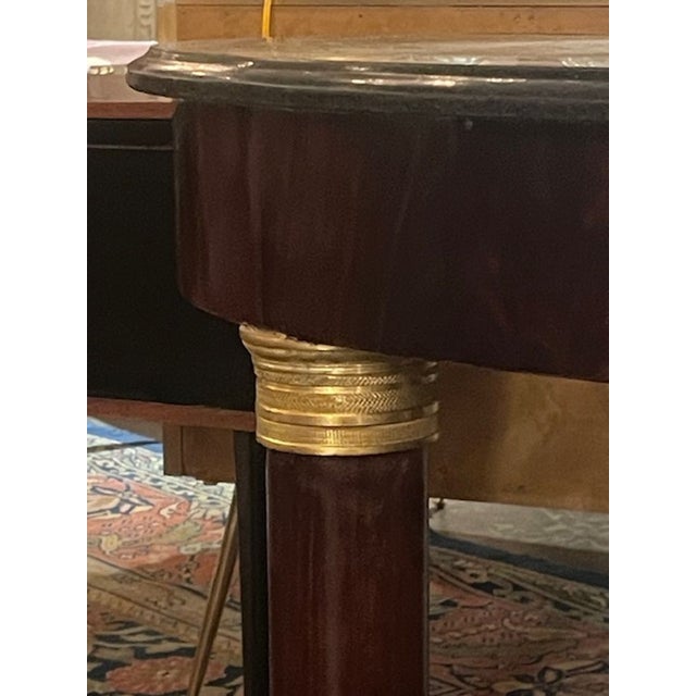 The 19th c. French Empire Mahogany Center Table is a stylish addition to any living or dining room. The beautiful mahogany...
