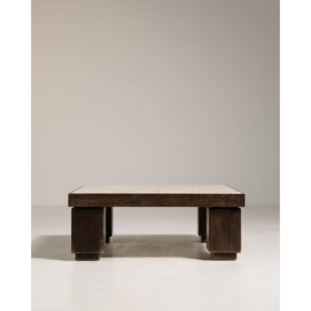 A commanding example of Italian Brutalist design from circa 1970, this coffee table pairs a richly veined travertine stone...