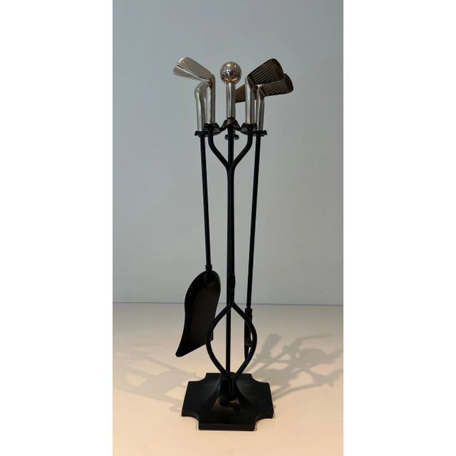 This very beautiful, rare and unusual model of a "Golf" fire kit in black lacquered metal and chrome-plated brass is...