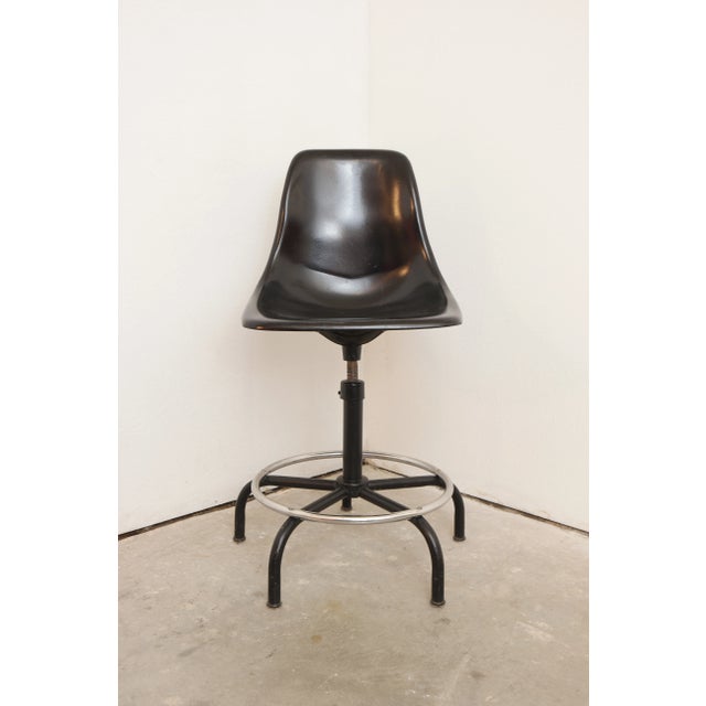 Mid Century Modern black fiberglass shell chair/barstool, in the style of the iconic Herman Miller shell chair, by design...