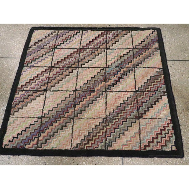 An antique American Hook Rug handmade during the Early 20th century. Measures: 2' 11" x 3' 3"