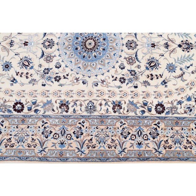 This nain rug is made of cotton and silk on cotton and is in a new and unused state. Very fine and dense link with approx....