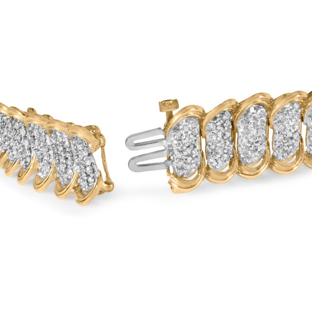 Indulge in the luxurious beauty of this exquisite 10K yellow gold pave diamond link bracelet. Adorned with 480 round...