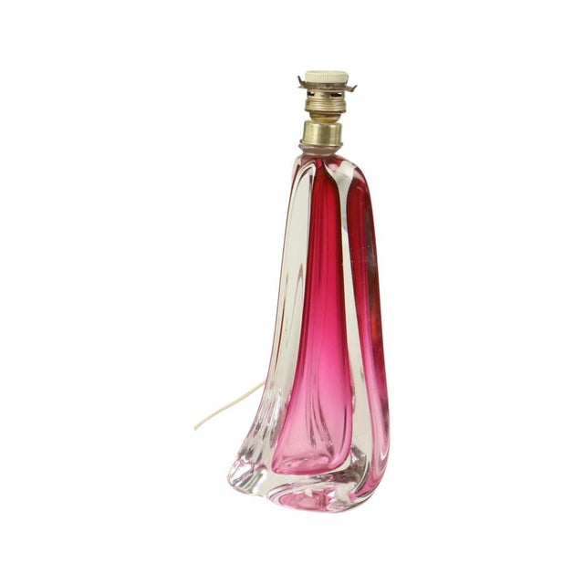 Beautiful hand-blown table lamp made of purple and pink colored crystal. The lamp features a striking quarter-turn twisted...