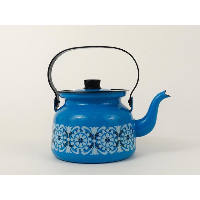 A lovely Scandinavian Mid-Century Modern enameled teapot / kettle from the 1960s. Designed by Kaj Franck and illustrated...