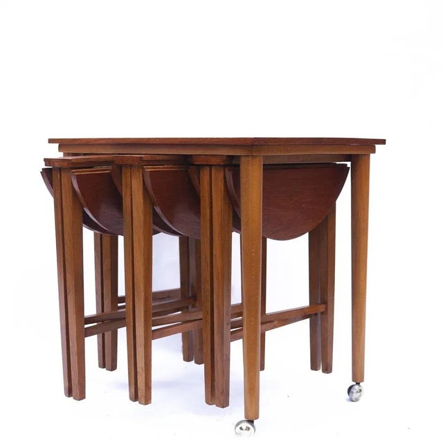 A set of teak pull out nesting tables by Poul Hundevad for Novy Domo. Set of 5. This piece is attributed to the mentioned...