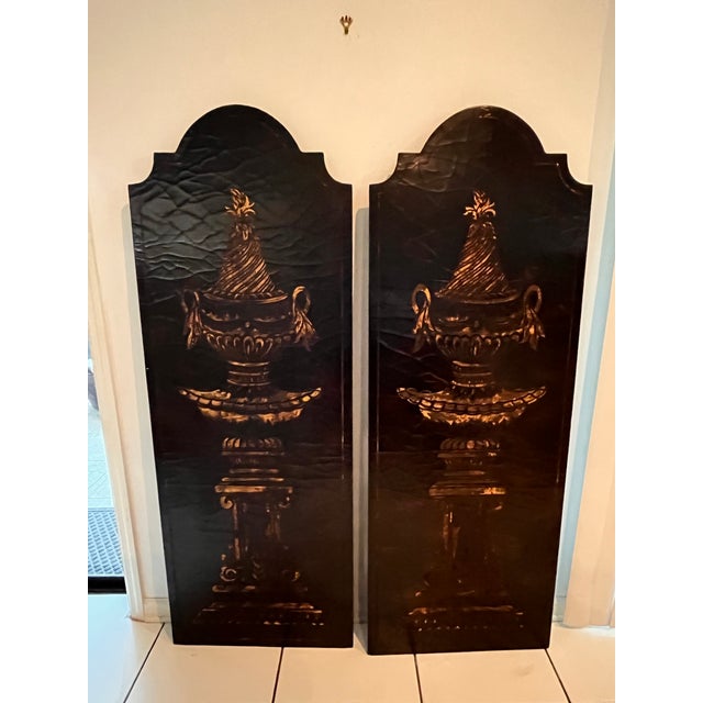 Striking monumental pair of vintage Empire Revival decorative wall panels featuring elaborate classical urns rendered in...