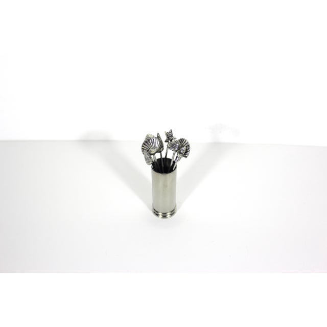 Fun set of 8 silver plated cocktail picks or forks in the shape of seashells with holder. The shell tops are silver plated...