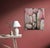 The artwork presents a striking interplay between natural elements and abstract patterns, featuring butterflies amidst...