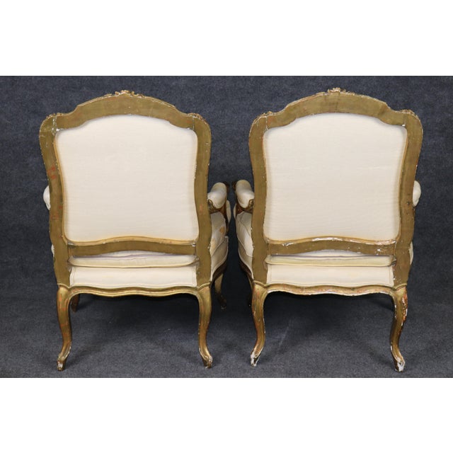 This elegant and generously proportioned pair of French Louis XV Revival giltwood bergère armchairs, dating from...